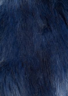 an animal fur texture is shown in this close up photo, it appears to be dark blue