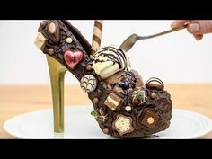 a chocolate shoe shaped like a woman's foot with candy and candies on it