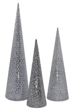 three silver sequined cones on white background