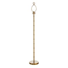 a floor lamp that is standing on a stand