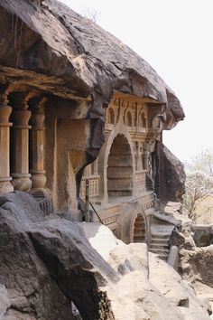 an old building built into the side of a cliff