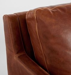 the back end of a brown leather couch