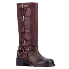 a pair of boots with buckles and straps on the side, in brown leather