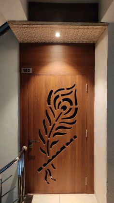 a wooden door with a stenciled design on it