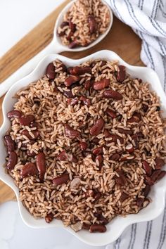 two white bowls filled with rice and beans