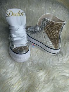 Custom Bling Chuck Taylor All Star Lift Platform. All designs handmade and embellished with a variety of high-quality crystals. Great for Quince's, weddings, proms, homecomings, birthdays, special events or just your everyday girly girl. Shoe Size: WOMEN'S size 5 to size 12 Size availability may vary based on our suppliers current inventory. If your size is out of stock at the time of your order we will notify you within 48 hours. ** PLEASE NOTE CONVERSE CHUCK TAYLOR SNEAKERS RUN ABOUT A WHOLE SIZE BIG, IF YOU'VE NEVER HAD A PAIR, I STRONGLY RECOMMEND TRYING A PAIR ON TO ENSURE CORRECT SIZE. ** Chuck Taylor All Star Lift Platform Embellished with high quality Gold, Silver, White stones. White Satin ribbon laces (original shoestrings provided with all orders) (NEW SHOES GUARANTEED) THESE CA Mickey Shoes, Bedazzled Shoes, White Chucks, Bling Converse, Chuck Taylor All Star Lift, Winter Wonderland Theme, Ribbon Laces, Custom Bling, Bling Shoes