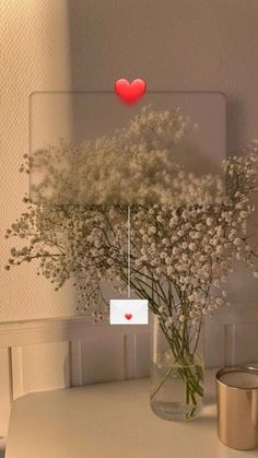 a vase filled with white flowers on top of a table