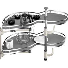 two tiered serving trays with cups and bowls on each shelf, one holding a coffee maker