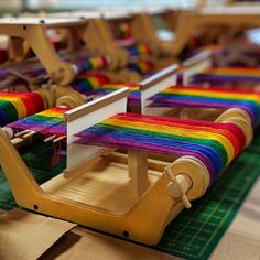 a row of looms sitting on top of a table