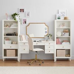 a white desk with a mirror, chair and bookshelf in front of it