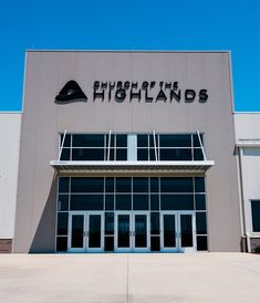 the front entrance of a building with glass doors and a sign that says, fishland's