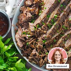 an image of a plate of meat with sauce and parsley on the side next to it