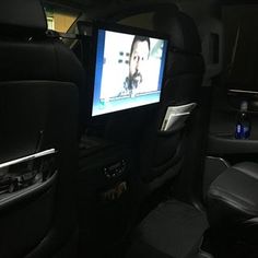 an entertainment system in the back seat of a car