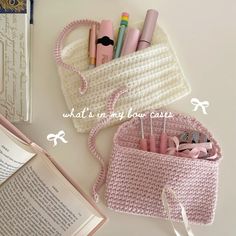 the contents of a crocheted purse are shown with pink pens and pencils