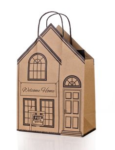 a brown paper bag with the words welcome home printed on it