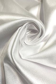 the white fabric is very soft and shiny