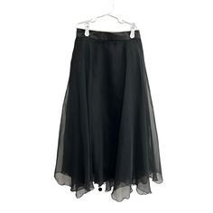 Chic vintage black chiffon skirt, perfect for professional environments. Flows elegantly with a high-low hemline. Made in the USA. * Black chiffon fabric * High-low hemline * Elastic waistband * Vintage style * 32" length * 11 1/4" waist * Made in the USA Features: * Tags: vintage skirt, black chiffon skirt, midi skirt, high-low skirt, elastic waist skirt, professional skirt, women's clothing, vintage fashion, made in USA, vintage clothing, office wear, stylish skirt, elegant skirt, goth skirt, fairy skirt * Skirt Size: Womens S Condition: Pre-Owned Good Excellent, pre-loved condition  Thank you for checking out my shop! Black Chiffon Skirt, Chiffon Midi Skirt, Professional Skirt, Goth Skirt, Fairy Goth, Skirt Elegant, Fairy Skirt, Stylish Skirts, Gothic Rock