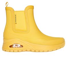 Get iconic style and comfort rain or shine with Skechers Street Uno Rugged - Dancing N The Rain. This fashion rain boot features a waterproof synthetic upper with a cushioned Skechers Air-Cooled Memory Foam insole, and a Skech-Air visible airbag midsole. | Skechers Women's Uno Rugged - Dancing N The Rain Boots | Medium Width | Skechers Air-Cooled Memory Foam cushioned comfort insole | Skech-Air visible airbag midsole | Pull-on synthetic upper | Flexible traction outsole | 1 1/2-inch heel height Yellow Weatherproof Rain Boots For Outdoor, Yellow Waterproof Rain Boots, Rain Boots Fashion, North And South America, Wide Shoes, Rain Or Shine, Rain Boot, Iconic Style, Skechers Women