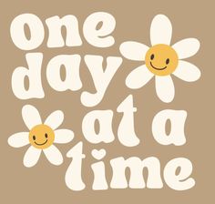 one day at a time with two daisies and the words'one day at a time '