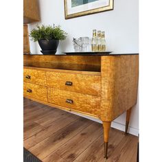 an old dresser with some bottles on it