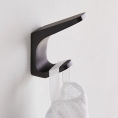 a towel hanging from a hook on the wall