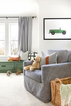 a living room filled with furniture and a teddy bear