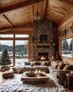 a living room filled with lots of furniture and a fire place in the middle of it