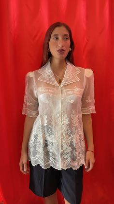 Amazing sheer short-sleeve shirt. Intricately with floral lace embroidery throughout, scallop edging at the Notch collar, sleeves and hemline. Made of sheer tulle with visible shoulder pads and finished with pearl buttons & loop fastening.  Size tag: Medium Fitted Formal Shirt With Floral Embroidery, Formal Fitted Shirt With Floral Embroidery, Elegant Summer Organza Tops, Formal Lace Tops With Sheer Sleeves, Formal Lace Blouse With Sheer Sleeves, Feminine Fitted Blouse With Sheer Sleeves, Classic Sheer Top For Formal Occasions, Fitted Blouse With Sheer Sleeves For Summer, Summer Wedding Blouse With Lace Sleeves