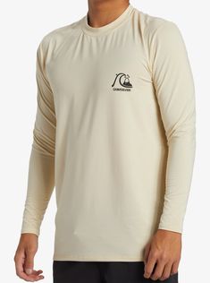 a man wearing a long sleeved shirt with the words, surfboard on it