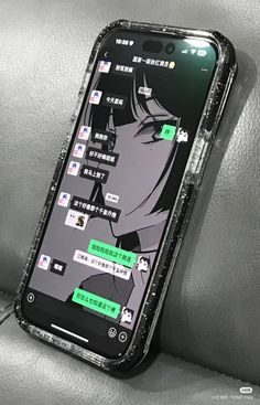 a cell phone sitting on top of a car seat covered in black and green stickers