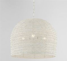 a white chandelier hanging from a ceiling