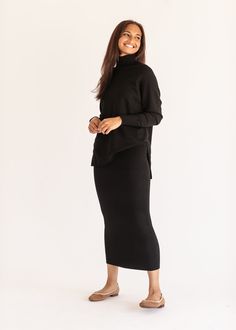 The Soft Knit Ribbed Sweater Skirt is the perfect addition to your modest closet! It features a modest straight fit, a stretchy waist, and no slit. This cozy skirt is crafted from a soft knit fabrication for a true seasonless staple. Just add the matching soft knit turtleneck for an effortless elevated casual look! Style | Maxi Color | Black SIZING TIPS Fit | Fitted Stretch | Stretchy Model | True to Size Cozy Skirt, Knit Sweater Skirt, Knit Skirt Outfit, Sweater Skirt Set, Long Skirt Outfits, Elevated Casual, Essential Dress, Black Knit Sweater, Church Dresses