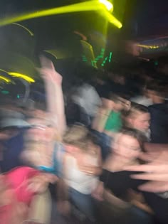 a blurry photo of people at a concert