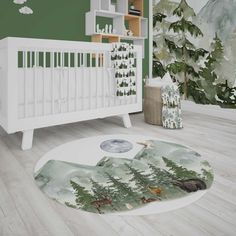 a baby's room decorated in green and white with a mountain scene on the rug