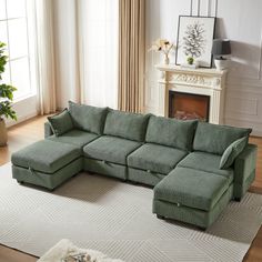 a green sectional sofa sitting on top of a white rug in a living room next to a fireplace