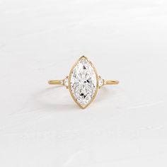 |14k Yellow Gold Bezel Marquise Engagement Ring, Dream Engagement Rings Unique, Marquise Engagement Ring Gold, Top Engagement Rings, Marquise Cut Engagement Ring, Bezel Set Engagement Ring, Melanie Casey, Bezel Engagement Ring, Ring Marquise