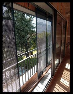 the sun shines through the windows in this room with wooden walls and flooring