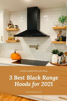 3 Best Black Range Hoods for 2021. Black range hood in farmhouse style kitchen with white cabinets and open shelving. Black Hood Ranges Kitchen, Black Stove Hood White Cabinets, White Kitchen Cabinets With Black Range Hood, Kitchens With Black Range Hoods, Black Kitchen Hood With Wood Trim, Stainless Steel Range Hood Ideas, Black Hood Vents Kitchen, Black Range Hood White Kitchen, Black Hood Kitchen