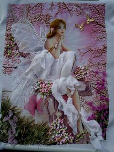 a painting of a fairy sitting in the grass with flowers and butterflies on it's wings