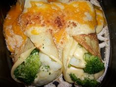 broccoli and cheese stuffed tortilla shells in a crock pot with melted cheese on top