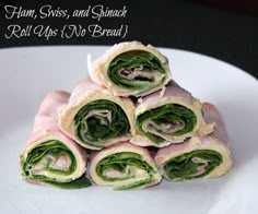 a stack of rolled up food items on a plate with the words ham, swiss, and spinach roll ups no bread