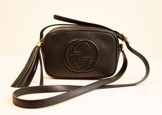 A mini Gucci Soho Disco crossbody bag in black leather with gold hardware. The interior is lined with black synthetic fabric and it consists of one compartment. The shoulder strap is in length adjustable (max. 120 cm). The bag is in very good condition with hardly any signs of use. Dimensions: Width:17 cm Height:12 cm Depth:6 cm This item will be shipped by a regular shipping carrier (such as PostNL or DHL) with tracking information, but without a signature for delivery and insurance. If you wis Gucci Soho Disco Bag, Soho Disco Bag, Gucci Soho, Gucci Soho Disco, Gucci Soho Disco Crossbody, Beige Fabric, Cross Body Bag, Light Beige, Bago