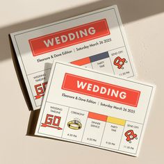 two wedding tickets sitting on top of each other