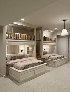 a bedroom with two beds and bunk beds in the middle of each bed is lit up by lights