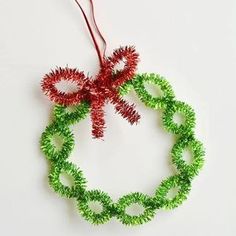 an ornament made out of green and red tinsel