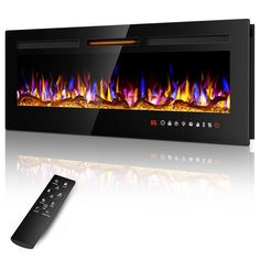 a remote control sitting next to a wall mounted fire place with flames in the fireplace