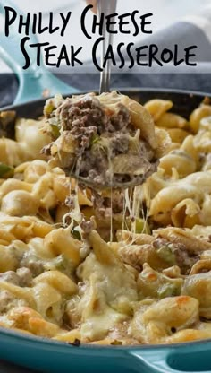 a blue casserole dish with meat and cheese being lifted by a spatula