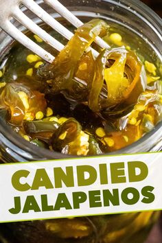 a jar filled with pickled jalapenos on top of a table