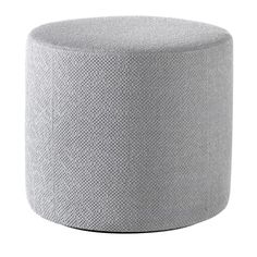 a grey ottoman that is sitting on a white surface, with the top half covered in fabric