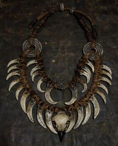 Crafted for the daring and unique, this neck jewelry embodies a fusion of Bohemian style and post-apocalyptic vibes. Perfect for shaman costumes, LARP products, and festival decorations, it features fangs and bird skulls for an edgy touch. This double necklace adorned with a ring necklace is a must-have for horror lovers looking to make a bold statement with their accessories. A distinctive piece that sets you apart from the crowd. ❗️DETALIS❗️ Our products are meticulously crafted by skilled art Viking Style Handmade Festival Jewelry, Handmade Gothic Horned Jewelry, Bohemian Skull-shaped Metal Jewelry, Handmade Bohemian Jewelry For Alternative Fashion, Unique Handmade Jewelry For Alternative Fashion, Shaman Costume, Demon Costume, Neck Jewelry, Horror Lovers